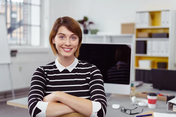 Cute young businesswoman or scholar in office — Stock Photo, Image