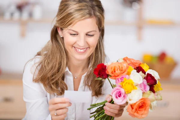 Woman with bunch of flowers — Stock Photo, Image