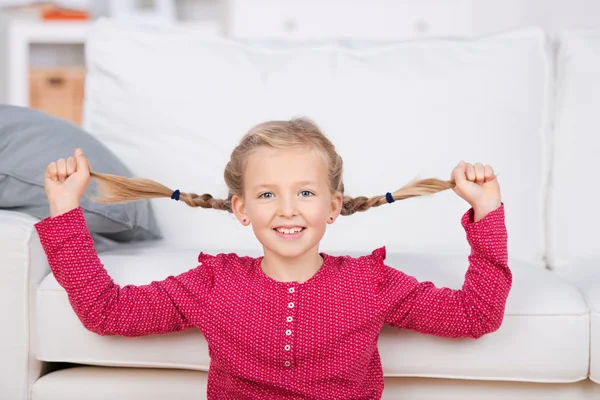 Girl pulling her pigtails — Stock Photo, Image