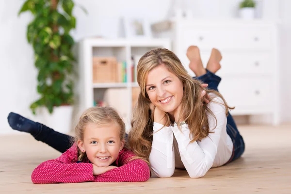 Mother and little daughter lying — Stock Photo, Image