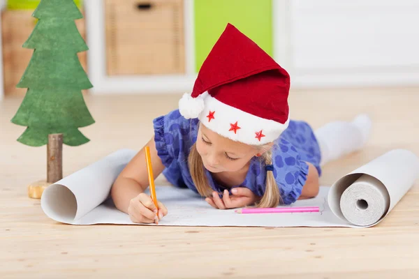 Cute girl writing letter to santa — Stock Photo, Image