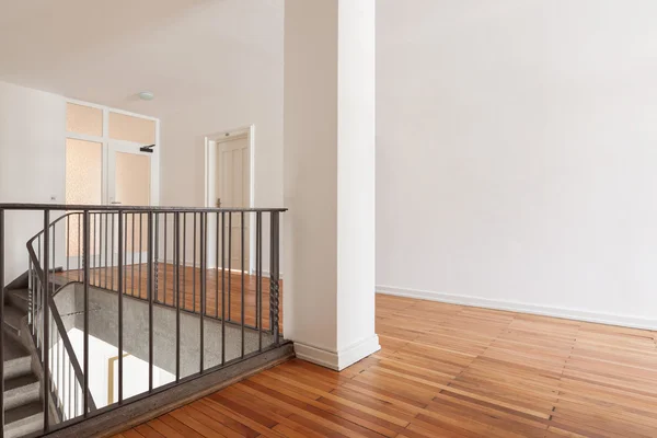 Wooden landing a flight of interior stairs — Stock Photo, Image