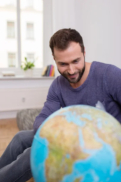 Happy man planning his next vacation — Stock Photo, Image