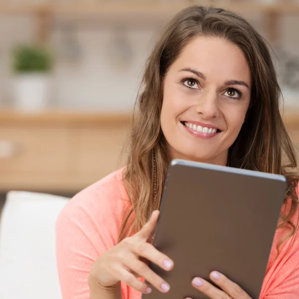 Woman daydreaming with table — Stock Photo, Image