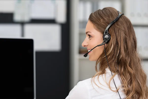 Young businesswoman in call center — Stock Photo, Image