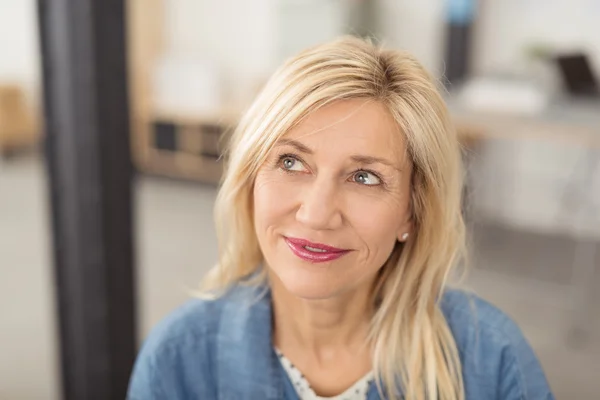 Thoughtful attractive middle-aged woman — Stock Photo, Image