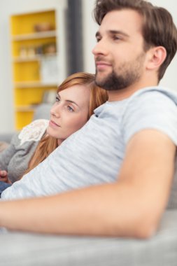 Young husband and wife relaxing together clipart