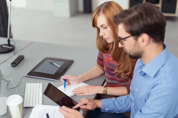 Young business partners working in the office — Stock Photo, Image