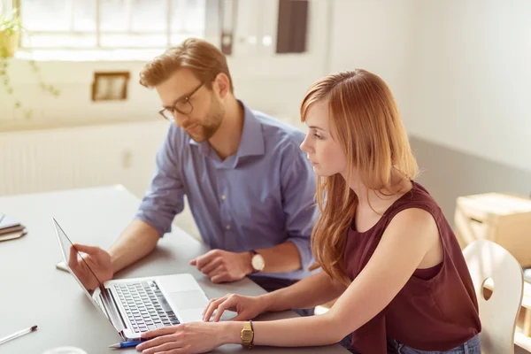 Serious Business People Watching at the Laptop — Stockfoto