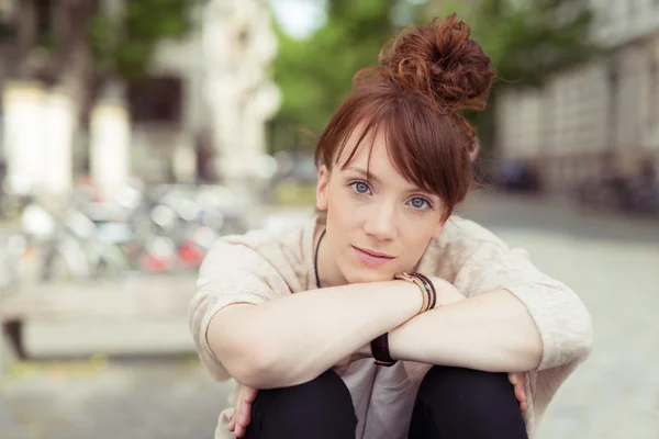 Young redhead woman staring intently at the camera — Stock Photo, Image