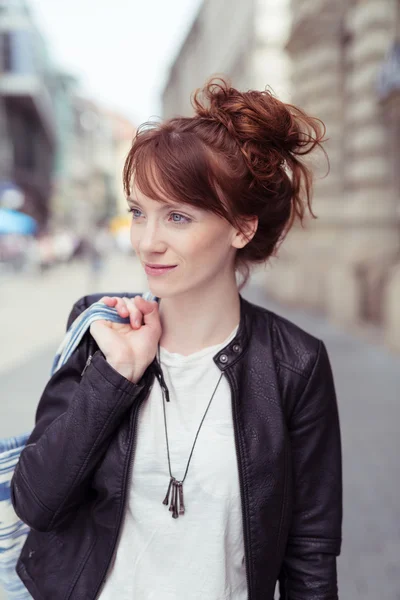 Redhead woman with her hair in a bun — Stockfoto