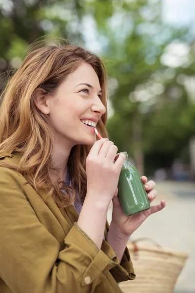 Thoughtful Smiling Girl Drinking Shake with Straw — Stock Photo, Image