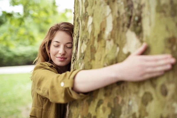 Thoughtful Teen Girl Hugging Huge Tree Trunk — Stok fotoğraf