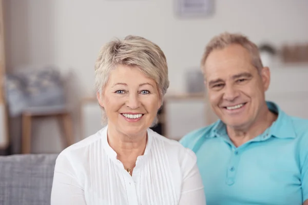 Senior Wife Sitting on Couch Beside her Husband — Stock Photo, Image