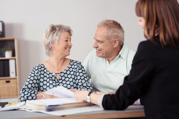 Happy Senior Couple Talking to a Female Agent — 스톡 사진