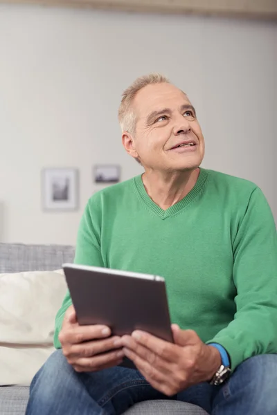 Thoughtful Senior Man with Tablet Looking Up — Stock Photo, Image