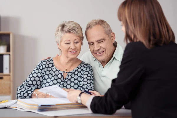 Senior Couple Listening to Female Mortgage Agent — 스톡 사진