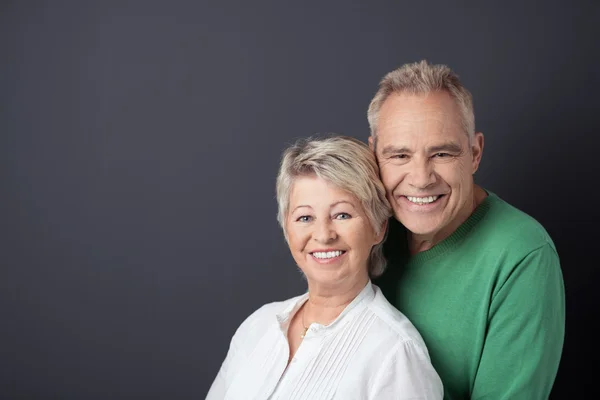 Sweet Matured Couple Against Gray with Copy Space — Stok fotoğraf