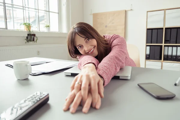 Happy businesswoman stretching with contentment — Stok fotoğraf