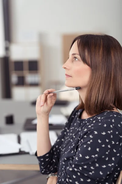 Pensive businesswoman sitting thinking — Φωτογραφία Αρχείου