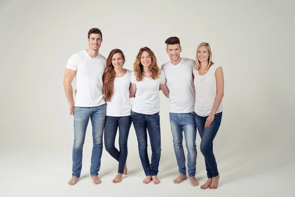 Grupo de Amigos en Ropa Casual Contra Blanco Imagen De Stock