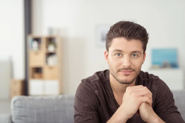 Gorgeous Bearded Guy on Couch Staring at Camera — 图库照片