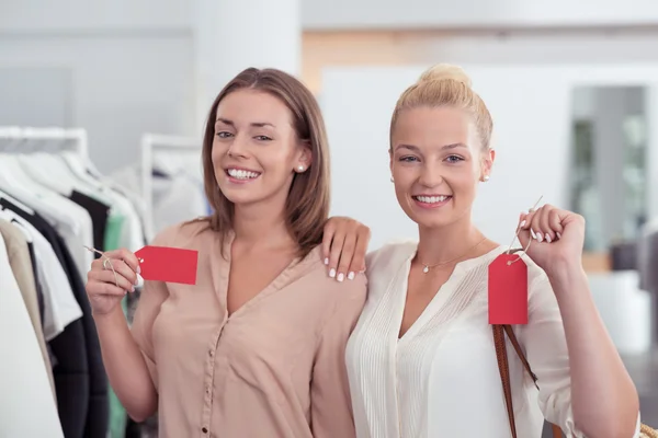 Best Friends Showing Red Tag inside the Store — Stock Photo, Image
