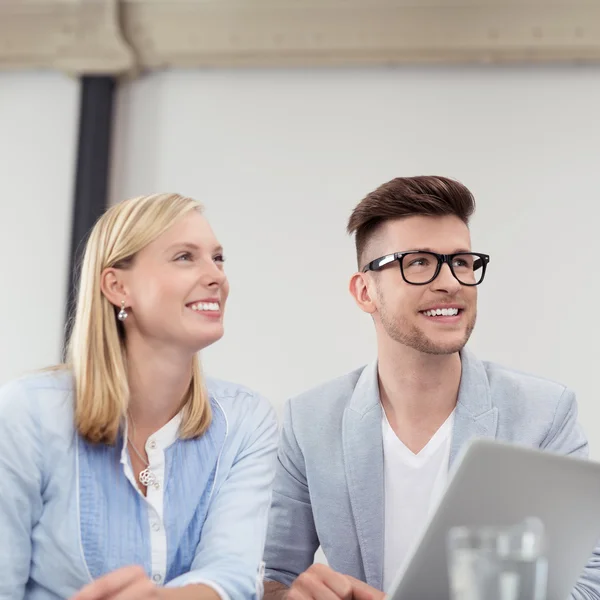 Young Business Couple Smiling Into the Distance — Stock Photo, Image
