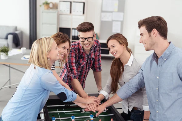 Young Workmates Putting Hands on One Another — Stock Fotó