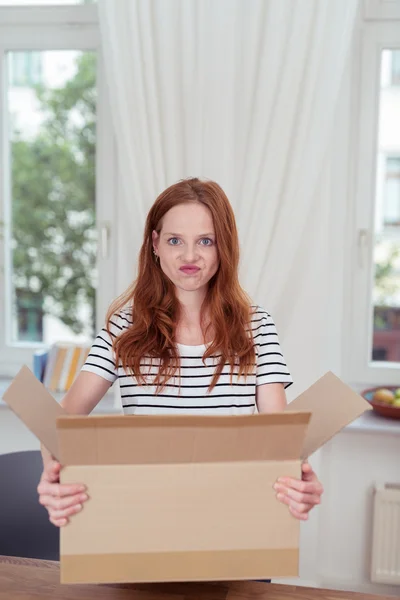 Young Woman with Funny Face Carrying a Carton Box — 图库照片