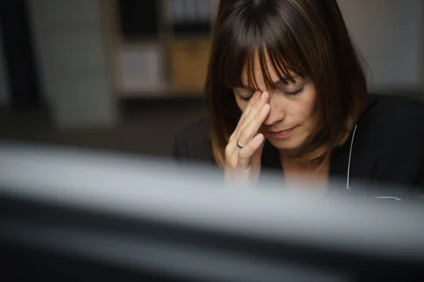 Businesswoman suffering from a stress headache — Stock Fotó