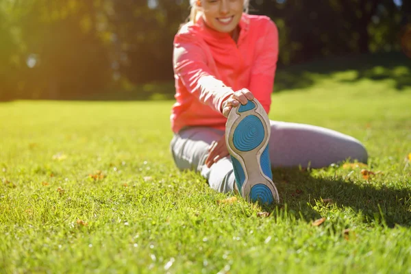 Fit Woman Stretching Leg at the Grassy Park — 스톡 사진