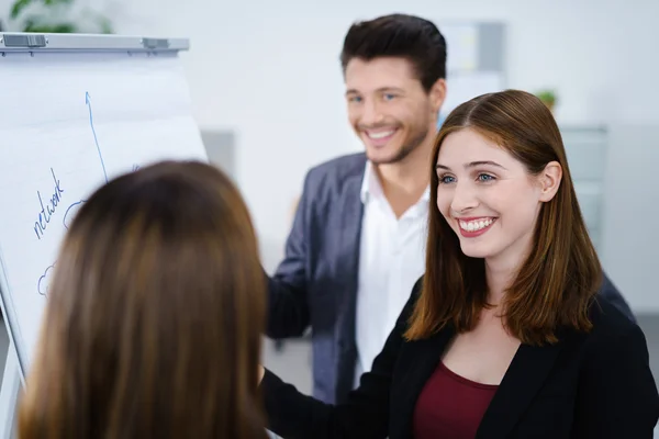 Business colleagues standing together and talking — Stock Photo, Image