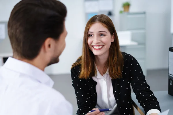 Two businesspeople talking in a meeting — Stock Photo, Image