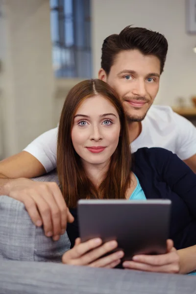 Couple sharing a tablet computer — Stock Photo, Image