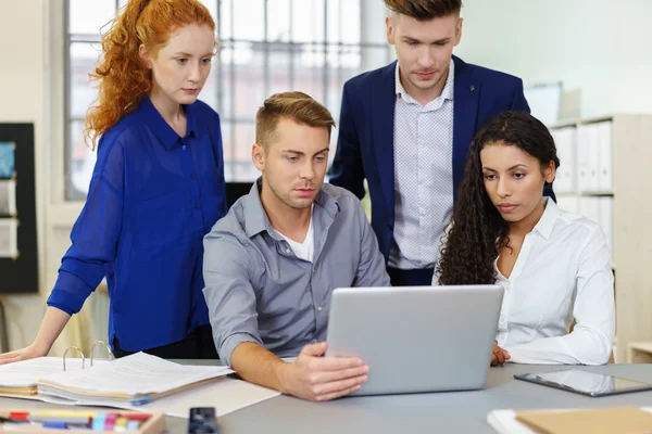 Office People Looking at the Laptop Together — Stockfoto