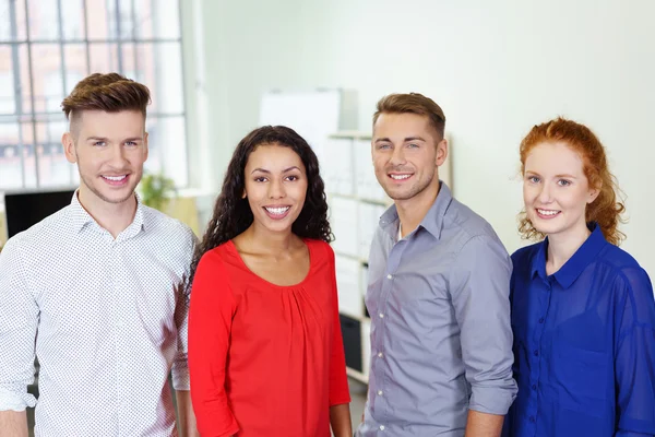Halbkörperschuss von vier jungen Büroangestellten — Stockfoto
