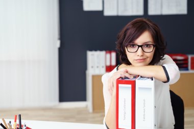 Office Woman Leaning on Binders on the Table clipart