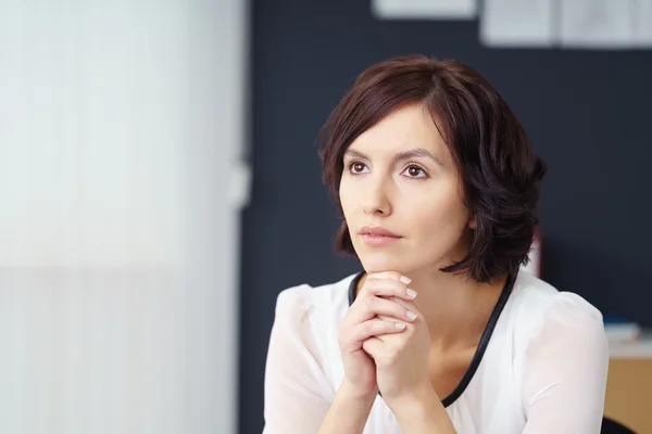 Pensive Woman Looking Away In the Office — Zdjęcie stockowe