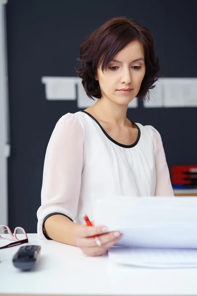 Office Woman Reading Some Documents at her Desk — Stok fotoğraf