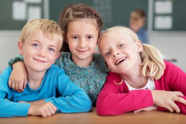Three happy friends in kindergarten clipart