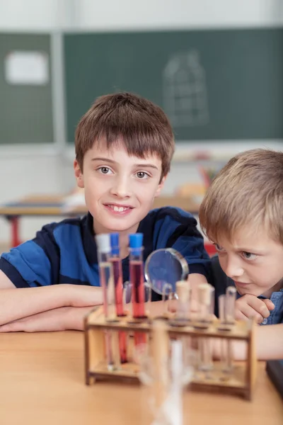 Two young boys in chemistry class — Stock Photo, Image