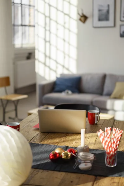 Table with Christmas Decors, Laptop and Cups — Stock Photo, Image