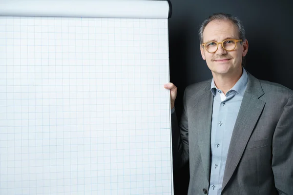 Confident middle-aged businessman with a chart — Stock Photo, Image