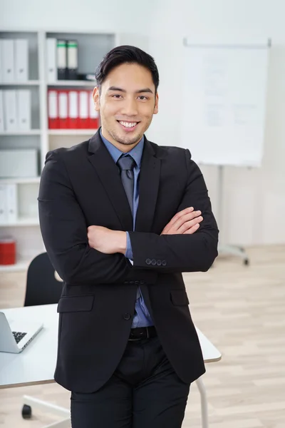 Confident smiling Asian businessman — стокове фото