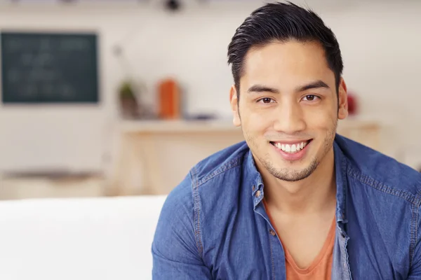 Happy young Asian man with a friendly smile — ストック写真