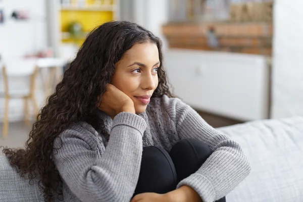 Woman daydreaming on the sofa — Stock Photo, Image