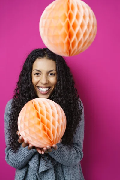 Playful Young Woman with Paper Crepe Spheres — Stock Photo, Image