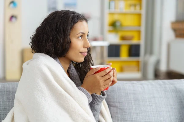 Young woman relaxing at home in winter — Stok fotoğraf