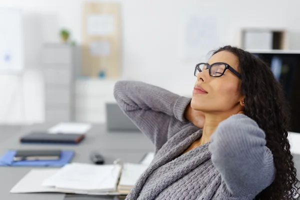 Office woman stretching her neck — Stok fotoğraf